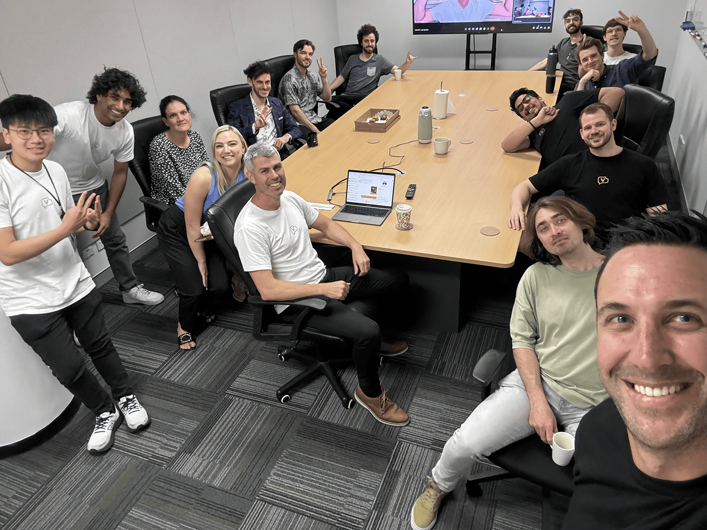 The UseVerb team around a meeting table